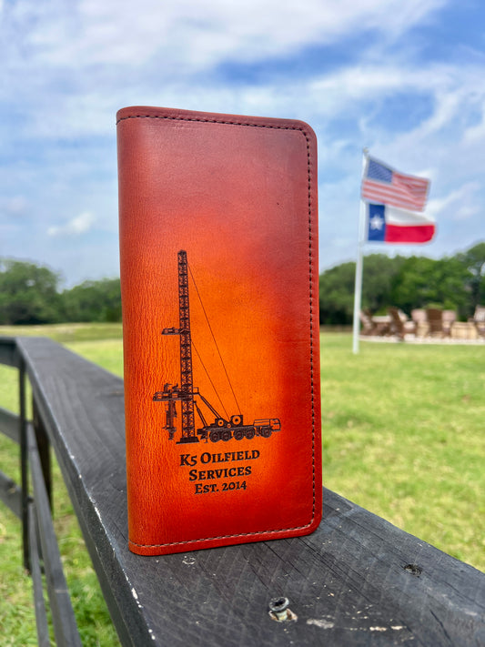 Leather tally book cover on wooden fence