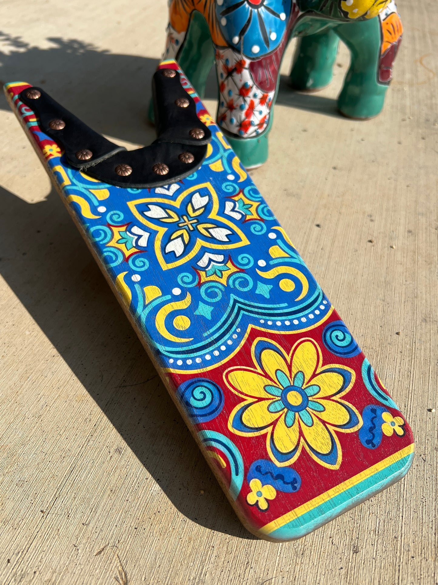 Colorful patterned shoe on a concrete surface