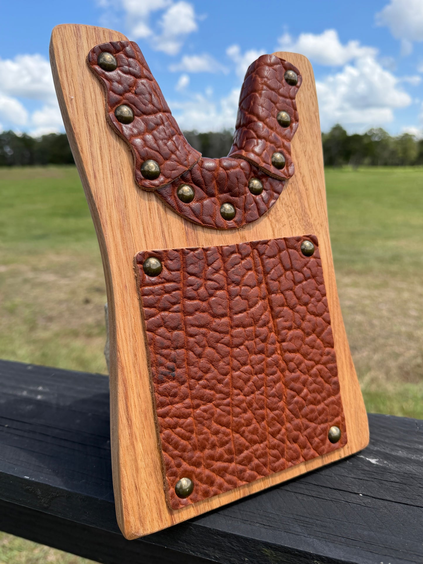 Detailed view of bison leather inlay from Wyoming on a custom handcrafted boot jack from locally sourced Texas pecan or oak from Pate Ranch Creation