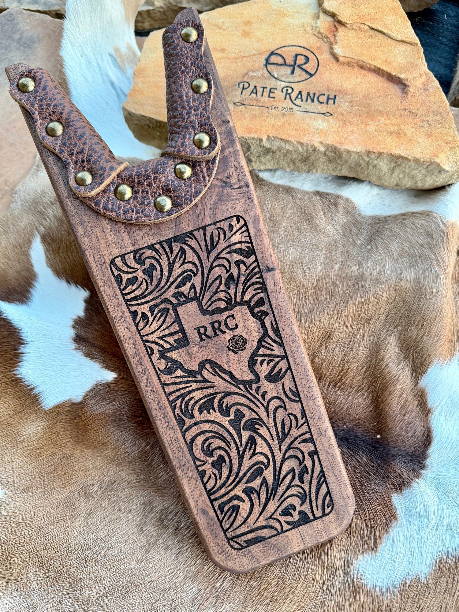 Vintage wooden boot jack with Texas personalized design with cowhide surface
