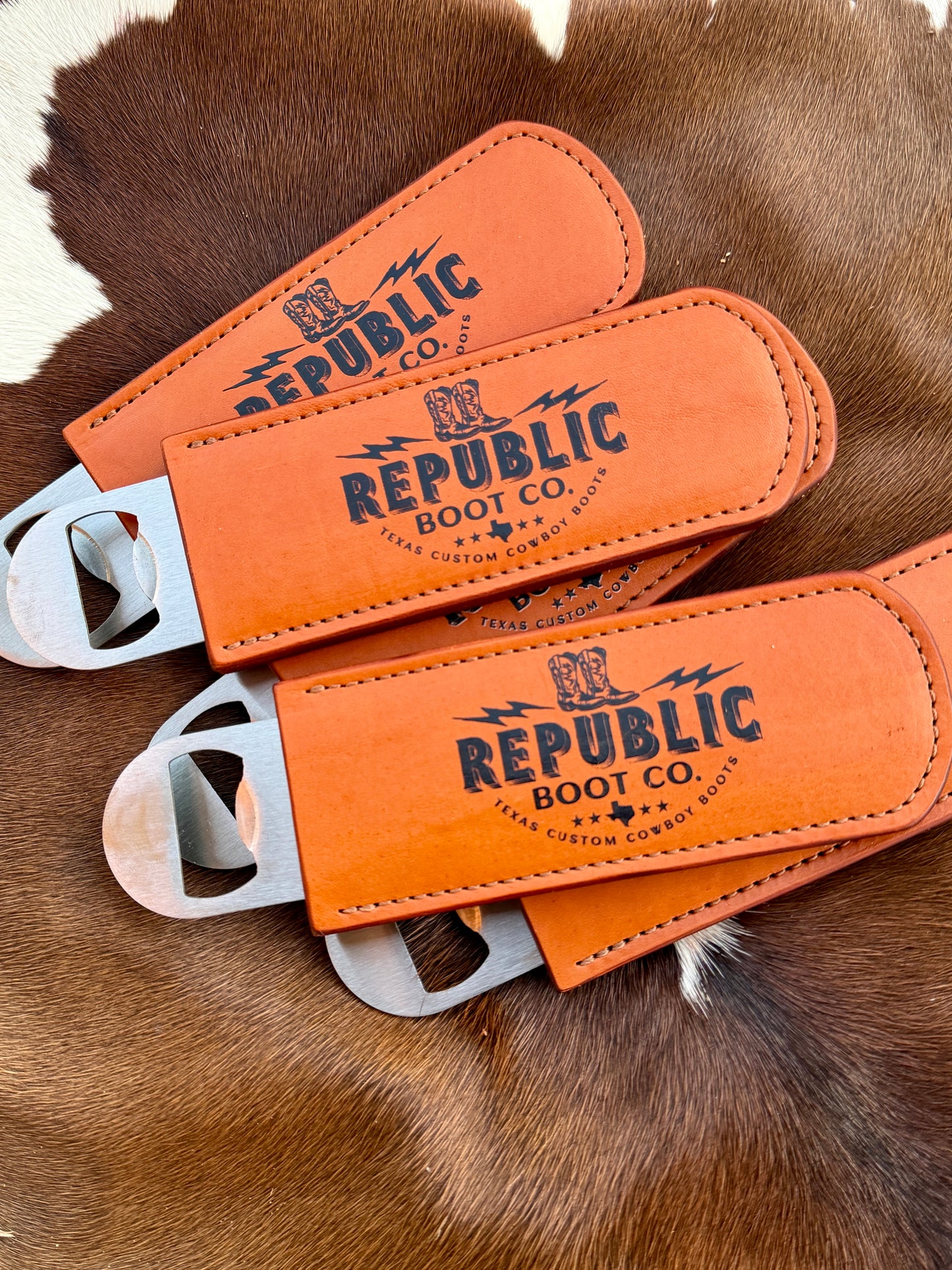 Three leather bottle openers branded with your logo