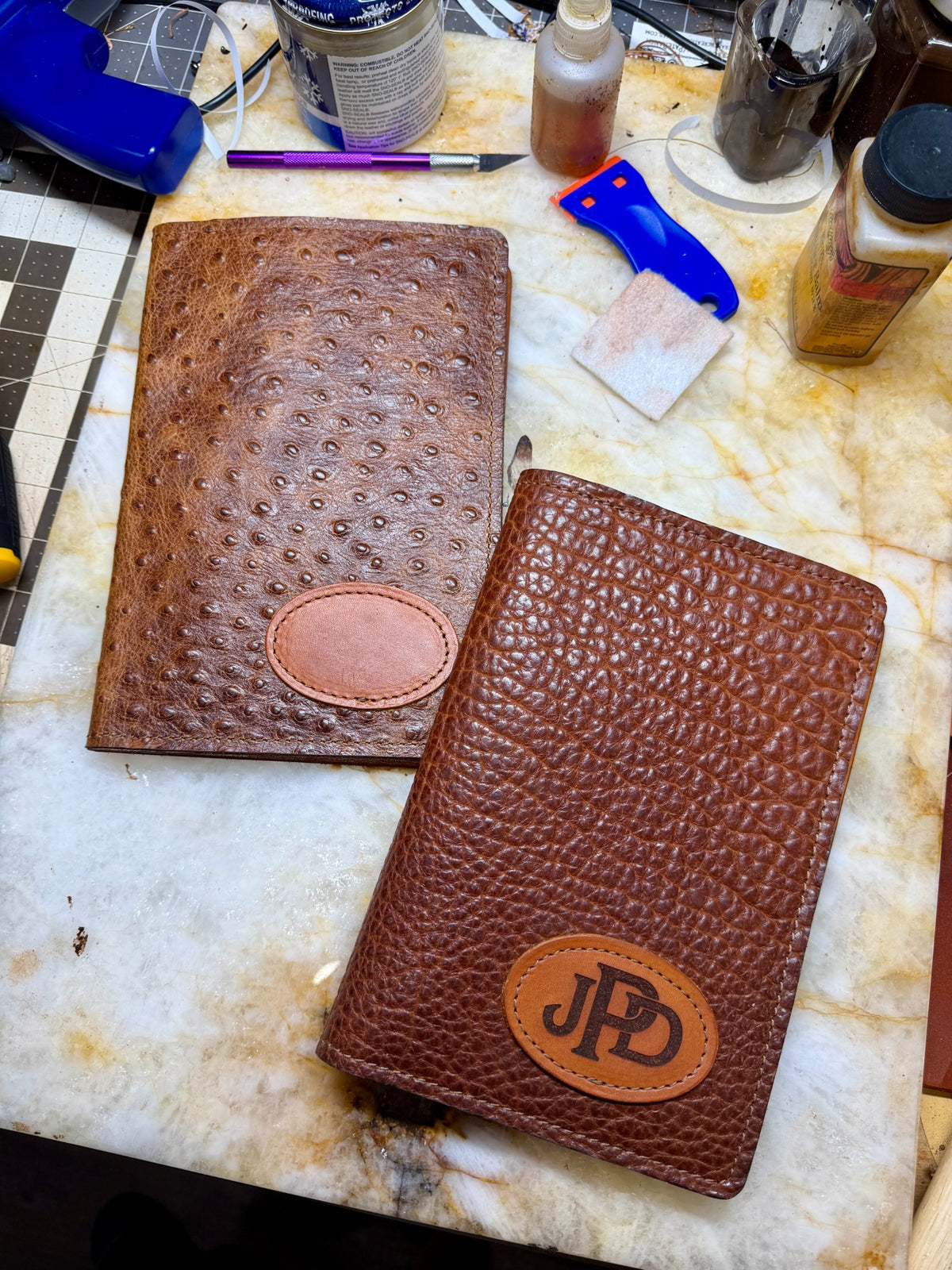 Custom monogrammed A5 leather padfolios with stitched oval personalization