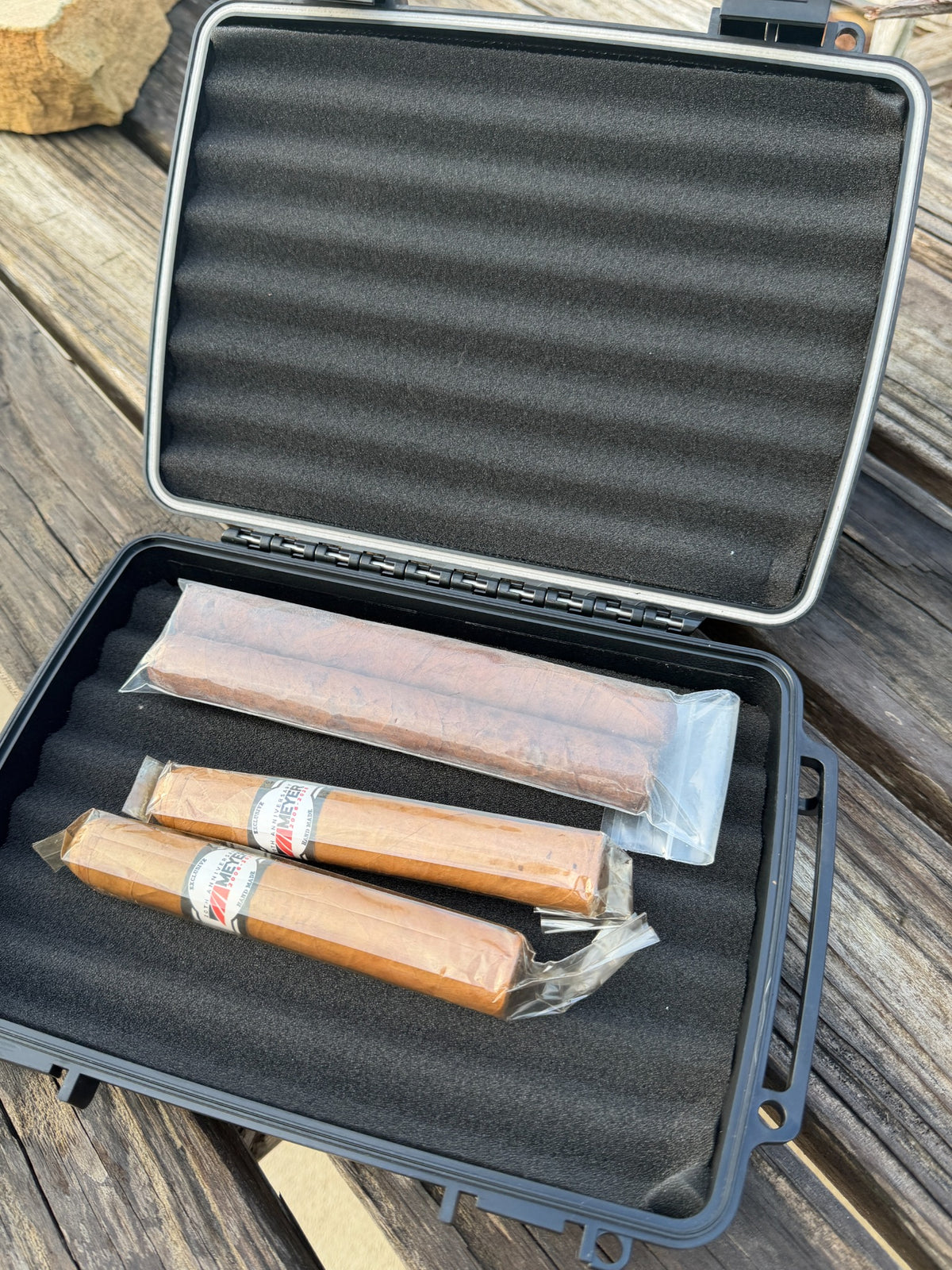 Open cigar travel case with foam protective interior and cigars shown for display
